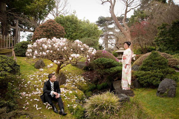 portrait of bride and groom in botanical garden - bride in traditional bridal kimono - photo by Hawaii based wedding photographer Derek Wong