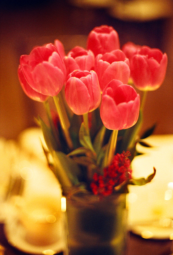 Coral tulip centerpiece bouquet - wedding photo by Harrison Hurwitz Photography