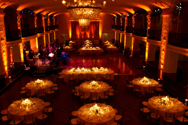 reception seating and dance floor in gorgeous interior of theater with incandescent lighting -photo by Washington DC based wedding photographers Holland Photo Arts