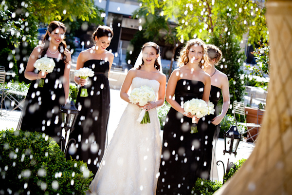 photo by Los Angeles based wedding photographer Jay Lawrence Goldman - bride in white a-line gown with bridesmaids in black a-line dresses 