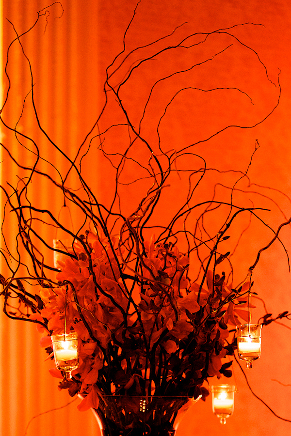 orange centerpiece with branches - hanging candles - wedding photo by top Philadelphia based wedding photographers Langdon Photography