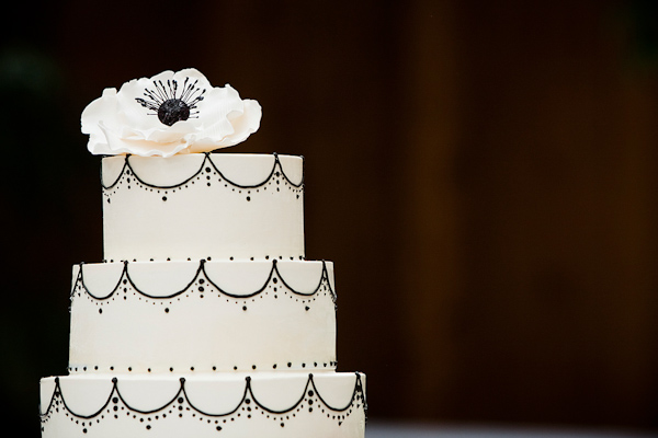 white wedding cake with black accents - real wedding photo by Seattle photographer Laurel McConnell
