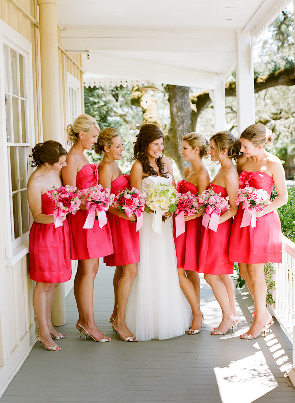 bride with bridesmaids in short hot pink dresses - photo by San Francisco based wedding photographer Lisa Lefkowitz