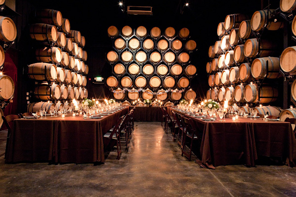 Reception seating in wine cave - photo by Orange County based wedding photographers Mark Brooke