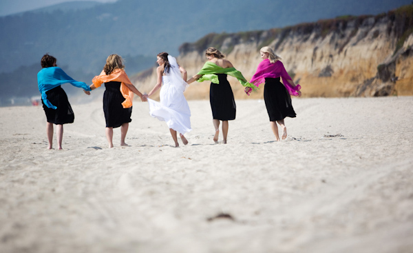 bright colored pashminas - beach wedding photo by Melissa Jill Photography