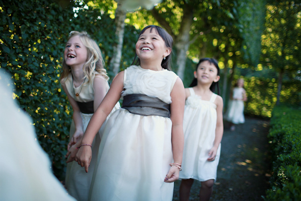 photo of adorable laughing flower girls - photo by Northwest wedding photographer Michele Waite