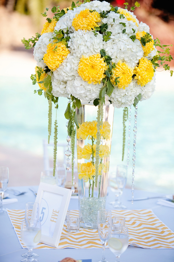 Bright and sunny white and yellow centerpiece - Photo by April Smith & Co.