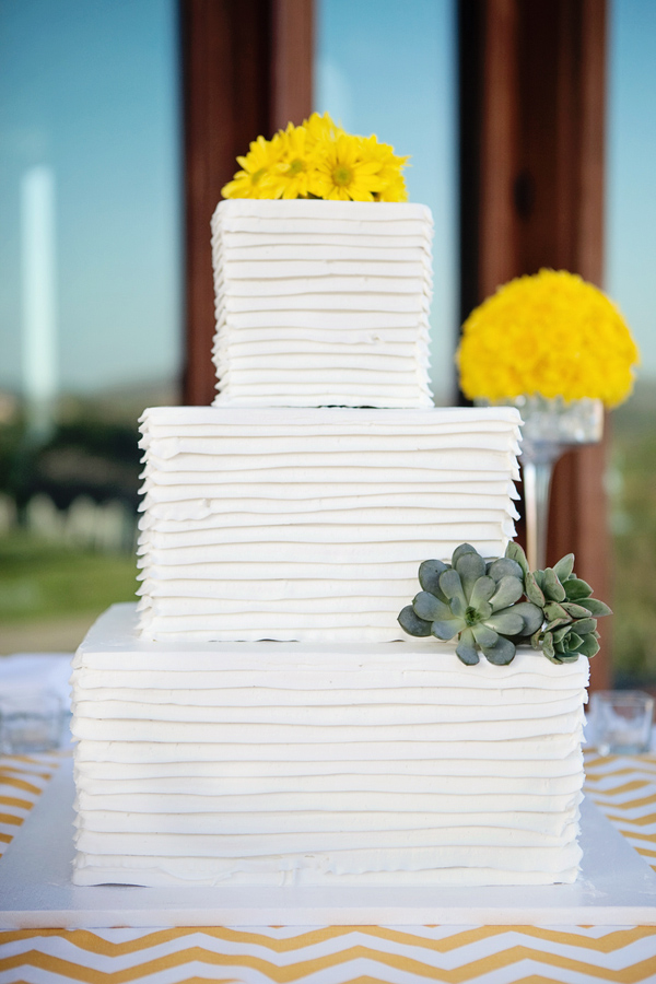 Stunning square, 3-tiered wedding cake with yellow flowers and succulents - Photo by April Smith & Co.