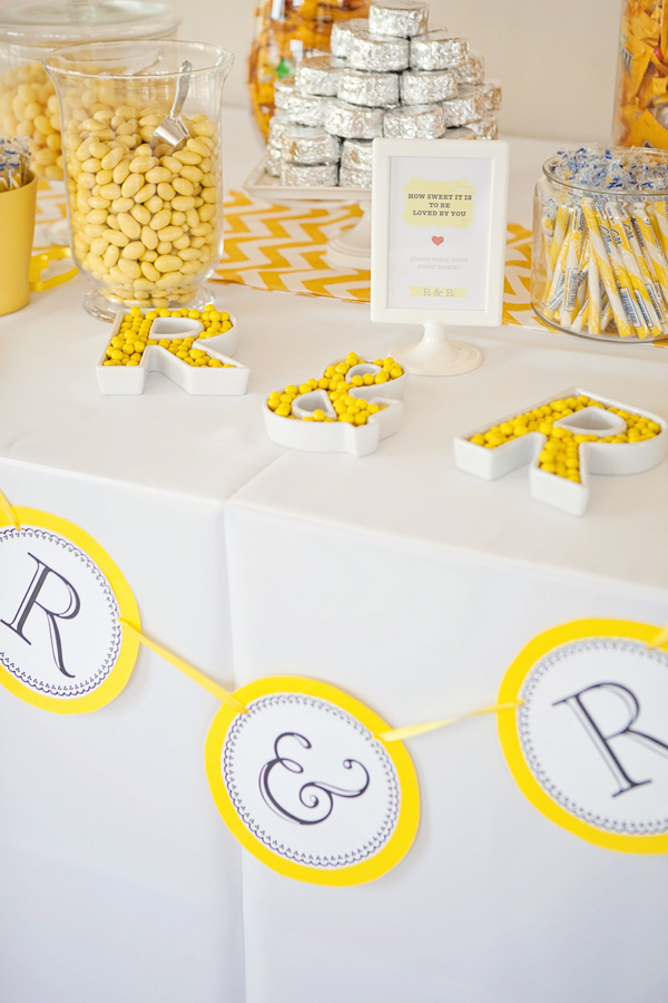 Cute, creative yellow and white themed candy table - Photo by April Smith & Co.