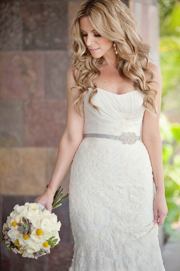 Beautiful bride holding her modern white, yellow and gray bouquet - Photo by April Smith & Co.