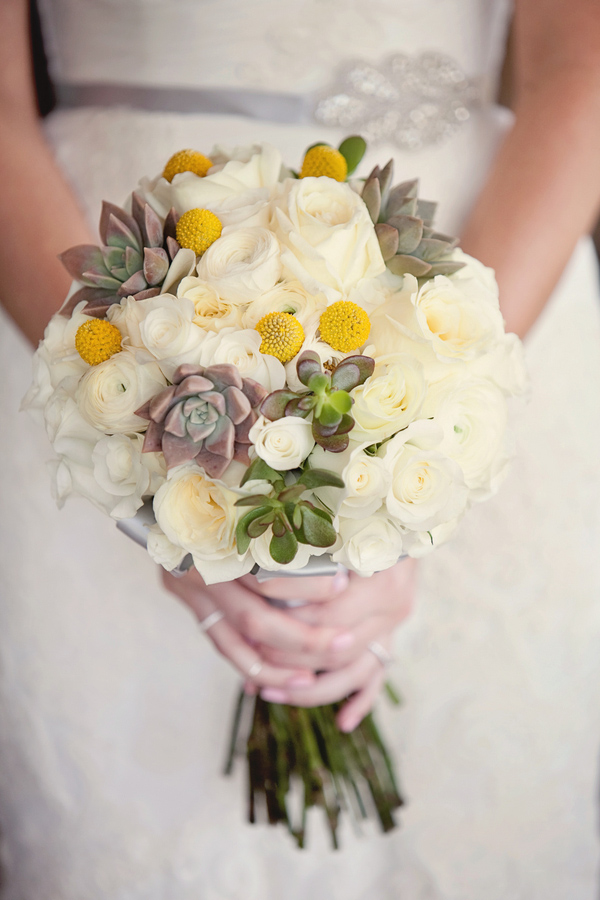 White and ivory bridal bouquet with touches of yellow and sage green - Photo by April Smith & Co.