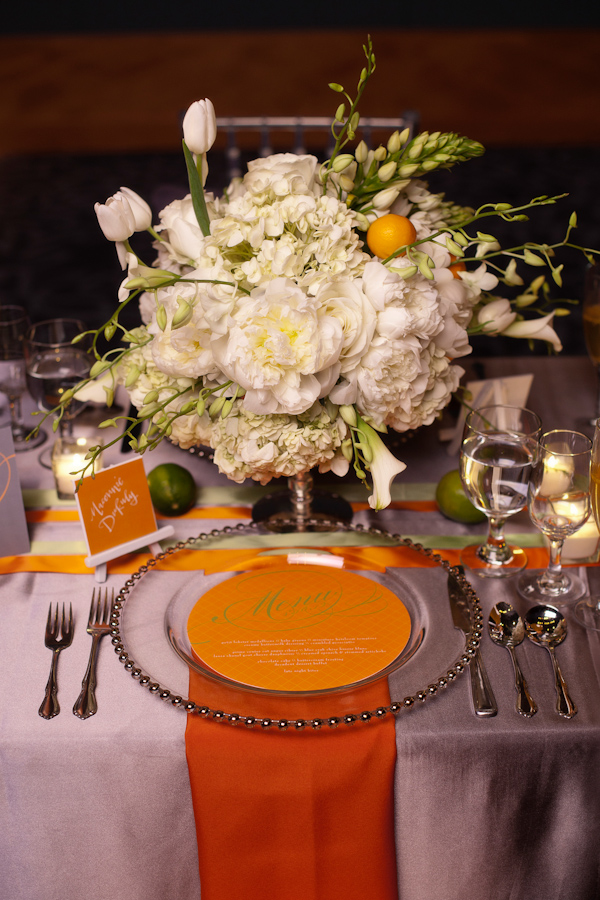 Orange and white wedding reception seating arrangement - Citrus Colored Wedding Decor Photo Shoot by Cadence Cornelius Photographs 