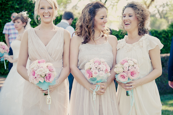 Happy bridesmaids in cream-colored summer cocktail dresses at wedding - Wedding Photo by Elizabeth Davis