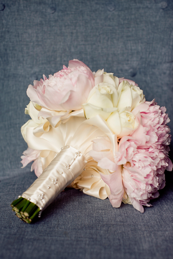 Bridal bouquet in light pink and cream with ivory ribbon stem wrap - wedding photo by Focus Photography