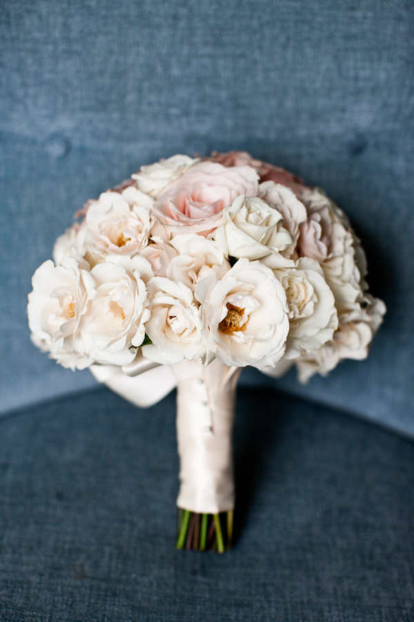 Bridal bouquet in light pink and cream with ivory ribbon stem wrap- wedding photo by Focus Photography