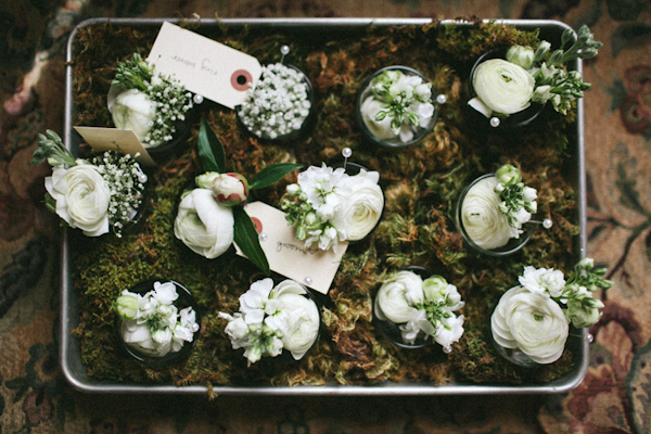 Rustic white wedding boutonnieres - Photo by The Schultzes