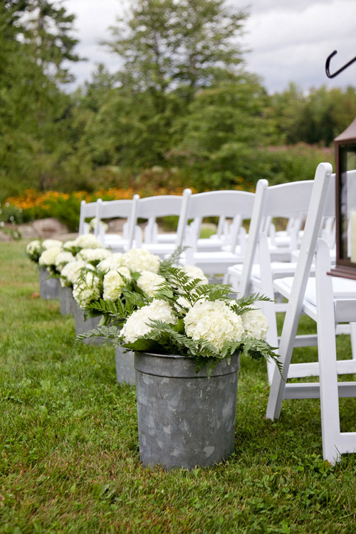 Rustic ivory hydrangea aisle decor for outdoor wedding - Photo by Emily Delamater
