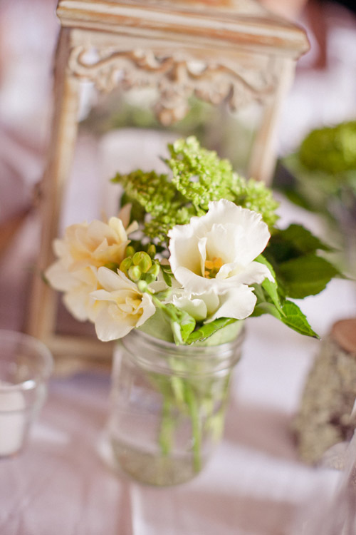 Simple and pretty white, ivory and green floral arrangement - Photo by Emily Delamater