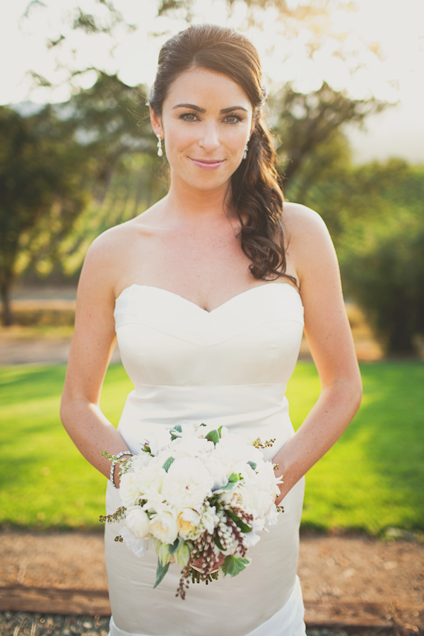 bride in white mermaid dress with side ponytail holding bouquet - warm, sunny, Sonoma California vineyard wedding photo by California wedding photographers EP Love