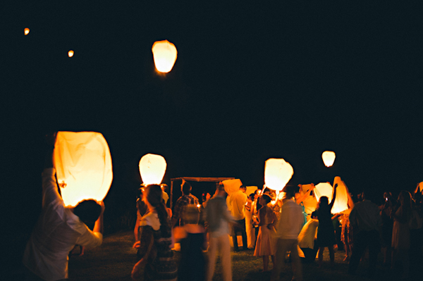 guests release lanterns into the sky - Sayulita, Mexico destination wedding photo by Mexico wedding photographer Jillian Mitchell