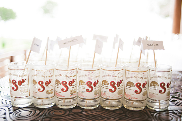 cockatil stirrers with guests names in Sol beer glasses, Photo by Jillian Mitchell Photography
