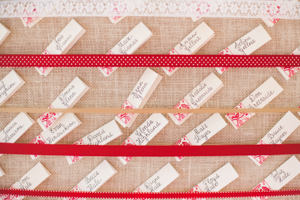 Creative red, white and burlap place card chart - Photo by Michelle Warren Photography