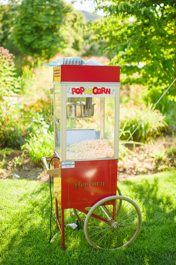 Vintage style popcorn machine for outdoor wedding reception - Photo by Nordica Photography