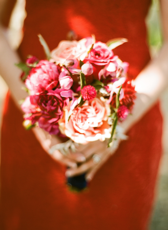 Colorful bridesmaid bouquet featuring shades of pink and red - Photo by Sylvie Gil Photography
