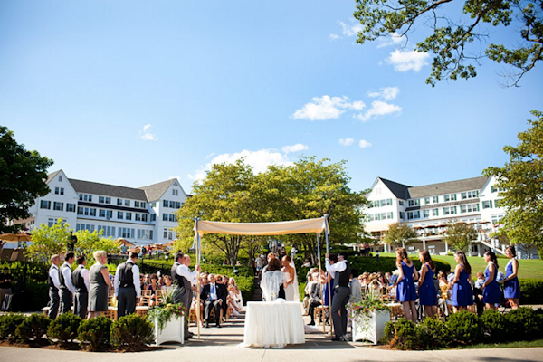 outdoor waterfront ceremony at sunny country club/ resort - preppy New York Sagamore resort wedding photo by New York wedding photographer Tracey Buyce