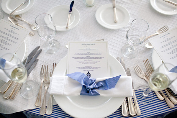 table setting with menu and napkin tied with light blue ribbon - preppy New York Sagamore resort wedding photo by New York wedding photographer Tracey Buyce