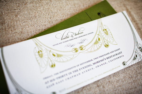 white invitation with green and black designs and green envelope - photo of wedding invitation designed by Wiley Valentine