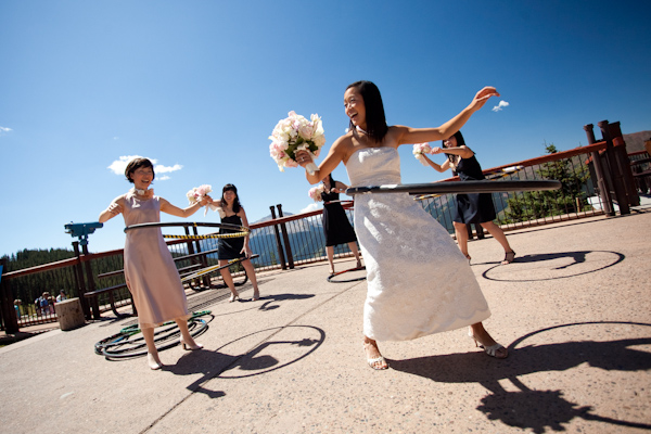 the bride and her bridesmaids hula hooping - photo by Washington DC wedding photojournalist Paul Morse