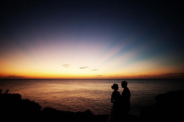 the happy couple share a special moment with the sunset - photo by Dallas based destination wedding photographer Poser