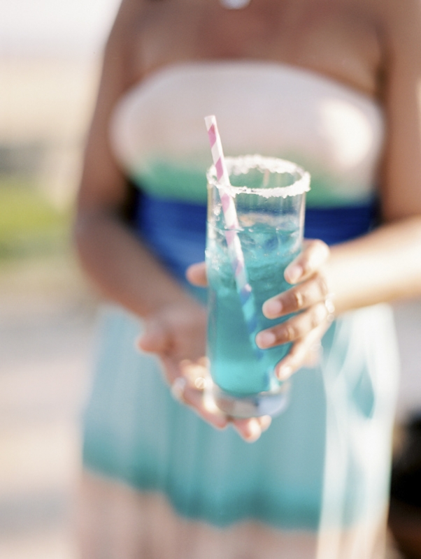 blue cocktail with pink striped straw, photo by Jillian Mitchell
