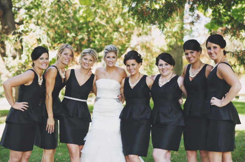 bridesmaids in black peplum dresses, photo by DWJohnson Studio