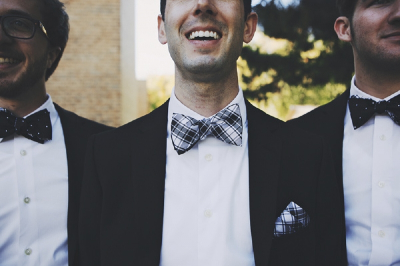 groom in plaid bow-tie and handkerchief, photo by DWJohnson Studio