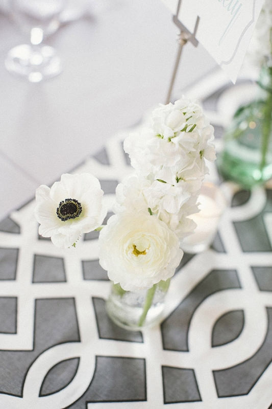 gray and white geometric table runner with white florals, photo by Paige Winn Photo