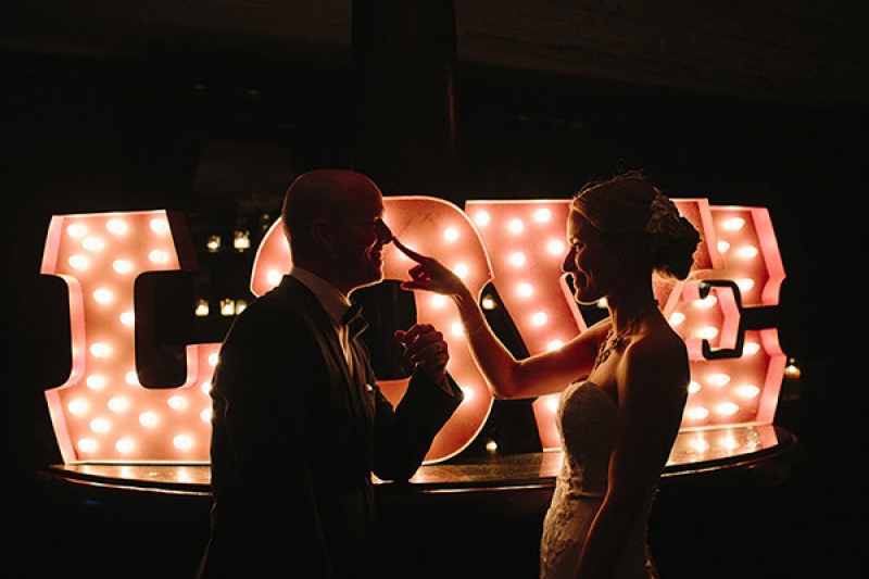 LOVE marquee sign at wedding reception, photo by Paige Winn Photo