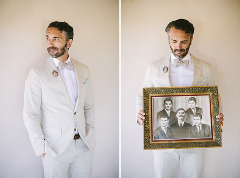 groom in light tan suit, with family heirloom portrait, photo by Adam Alex