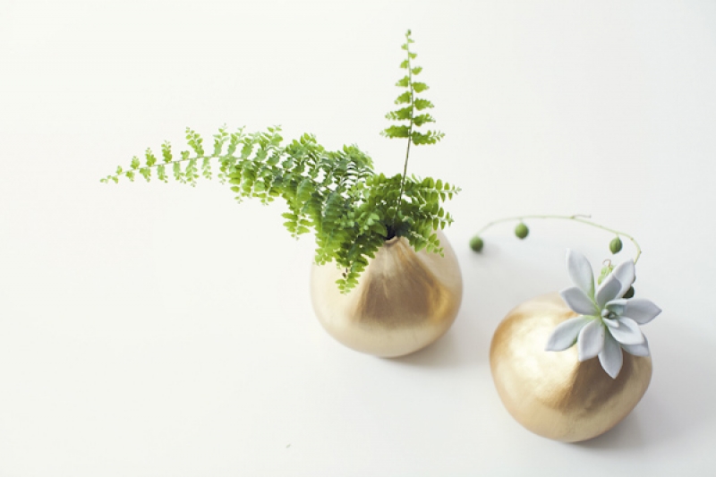 ferns and succulents in gold vases, photo by Studio Uma
