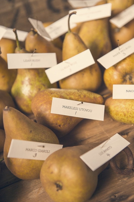 name escort cards pinned to pears, photo by Studio Impressions