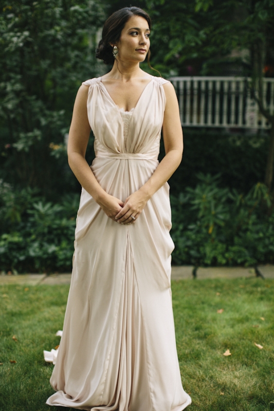 bride in blush draped long wedding dress, photo by Ely Brothers Studio