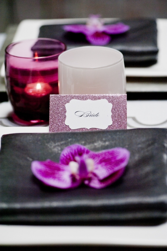 sparkly purple seating card and orchid at place setting, photo by Nikki Closser