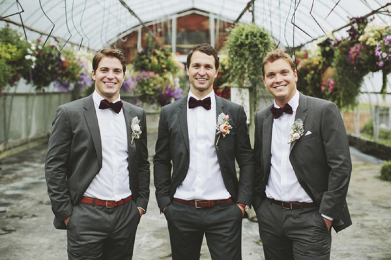 groom and groomsmen in gray suits with bowties, photo by Rowan Jane Photography
