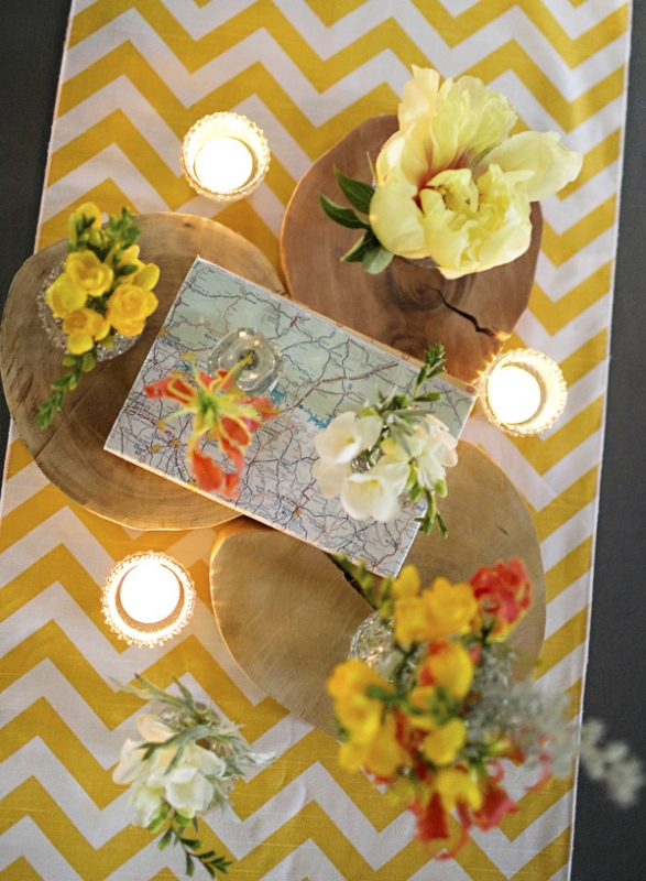 yellow geometric table runner with yellow and orange floral centerpieces, photo by Paperlily Photography