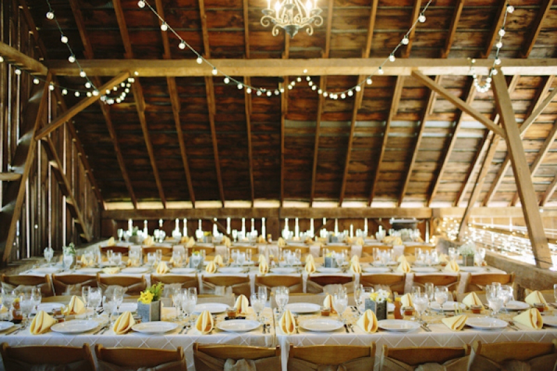 reception seating and place settings at barn wedding, photo by Dan Stewart Photography