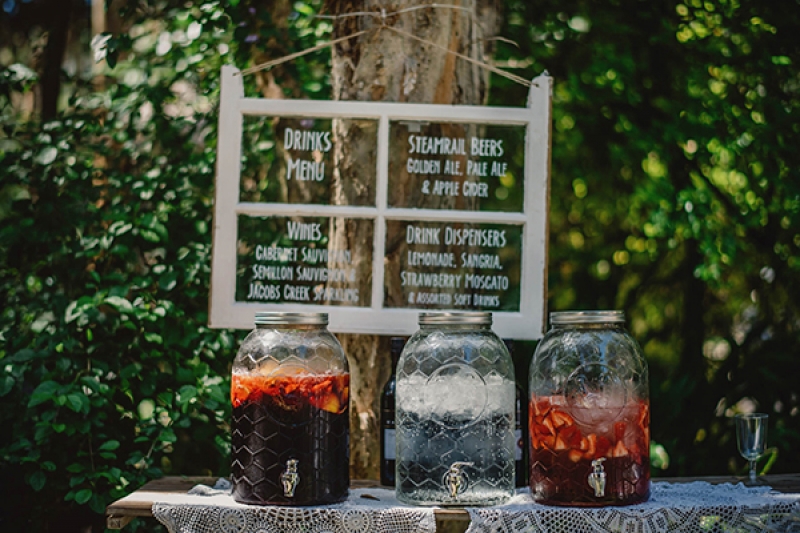 colorful eclectic backyard wedding Gabe McClintock DIY window drink menu drink bar