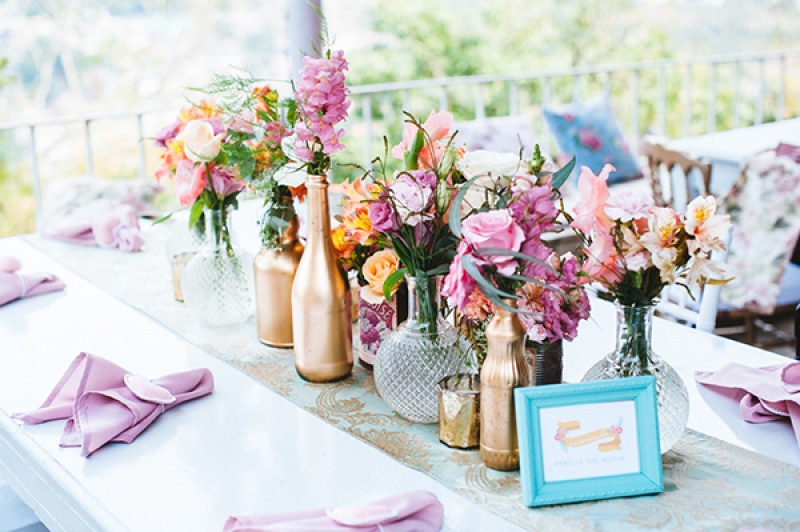 Eclectic backyard wedding reception decor vintage elements tablescape