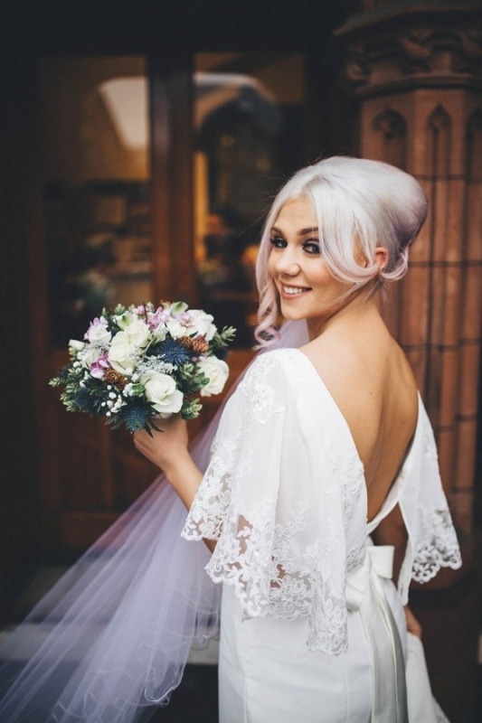 alternative bride with lavender up-do and low-back gown