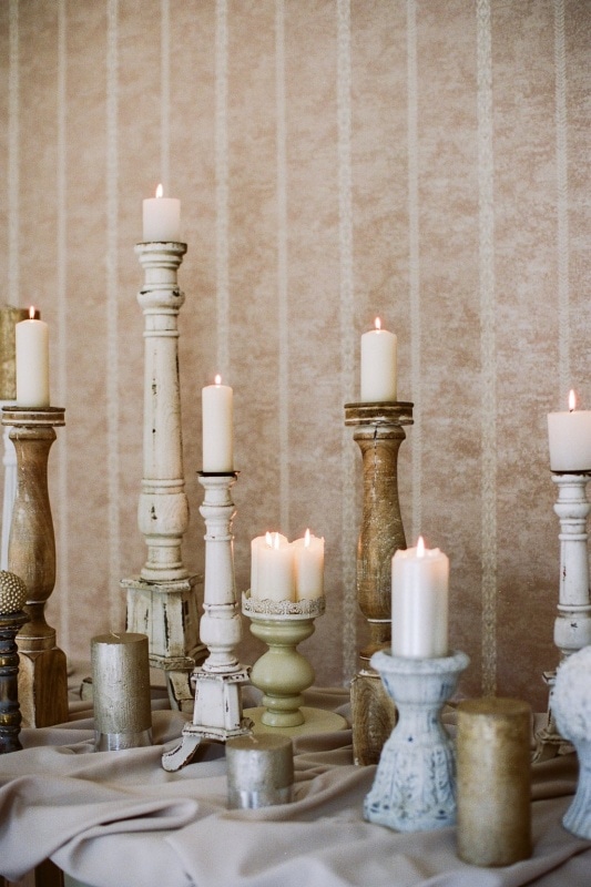 antique candlesticks at various heights